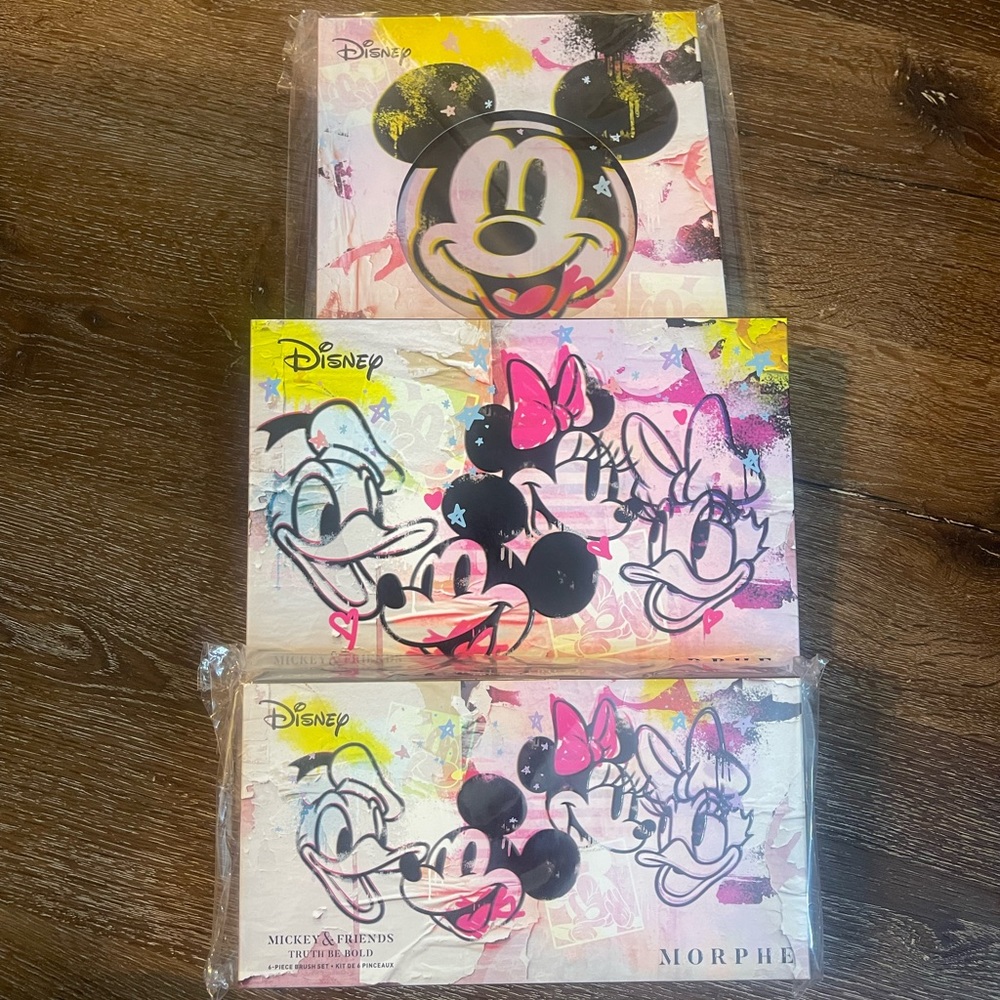 A brand new beautiful Disney edition palette, brush and mirror set.